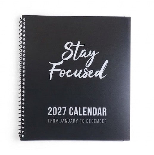 A black spiral-bound 2027 calendar with 'Stay Focused' and '2027 CALENDAR' printed in white on the cover, shown on a plain white background.