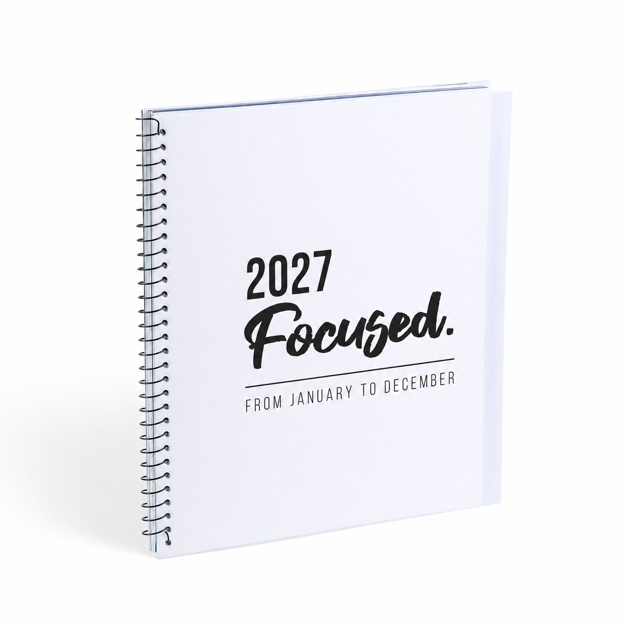 A white spiral-bound 2027 calendar or planner cover standing upright on a white background, with black text reading '2027 Focused. FROM JANUARY TO DECEMBER'.